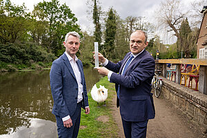 Will Forster and Ed Davey test a water sample